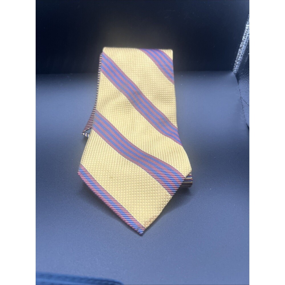 Tommy Hilfiger Tie. Gold With Blue and red striped silk .